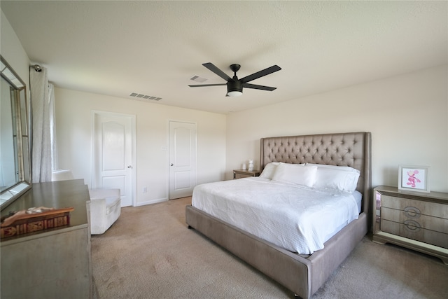 bedroom with light colored carpet and ceiling fan