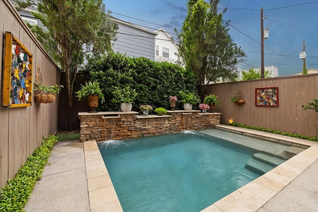 view of pool with pool water feature