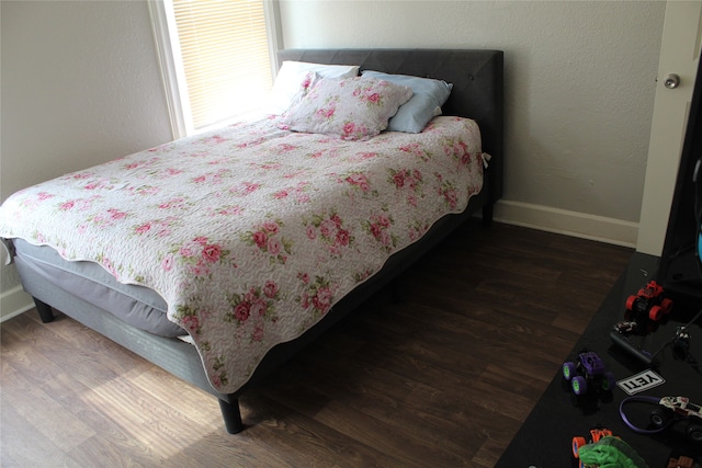 bedroom featuring dark wood-type flooring