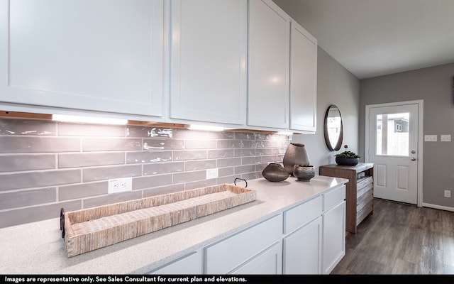 kitchen featuring white cabinetry, tasteful backsplash, and dark hardwood / wood-style flooring