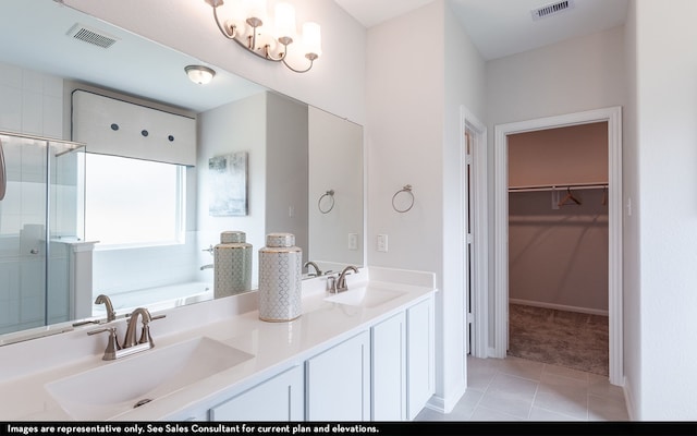 bathroom featuring vanity, separate shower and tub, and tile patterned floors