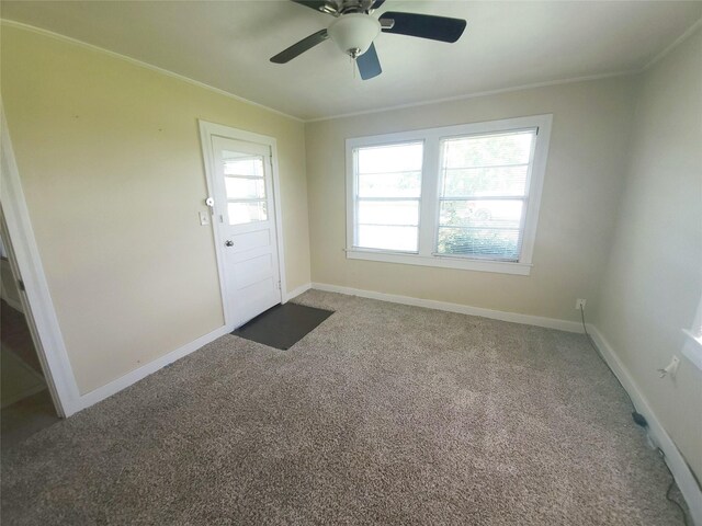 4915 County Road 227, Freeport, TX 77541 - doorway to outside featuring ornamental molding, carpet floors, and baseboards