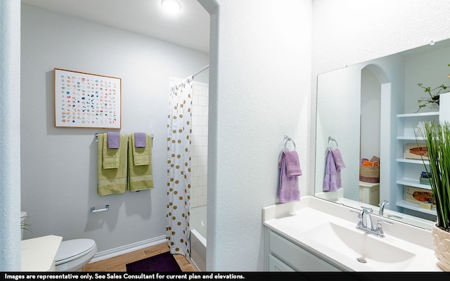 full bathroom with vanity, shower / tub combo with curtain, toilet, and hardwood / wood-style flooring