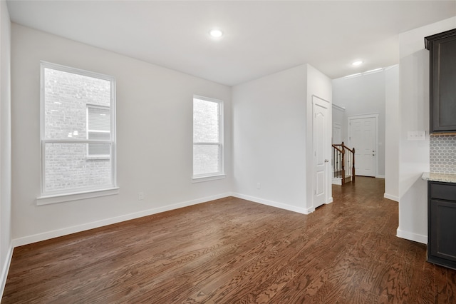 empty room featuring dark wood-type flooring