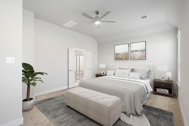 bedroom with ensuite bath, visible vents, vaulted ceiling, carpet, and baseboards