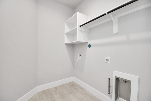 laundry room featuring hookup for a washing machine, laundry area, electric dryer hookup, gas dryer hookup, and baseboards