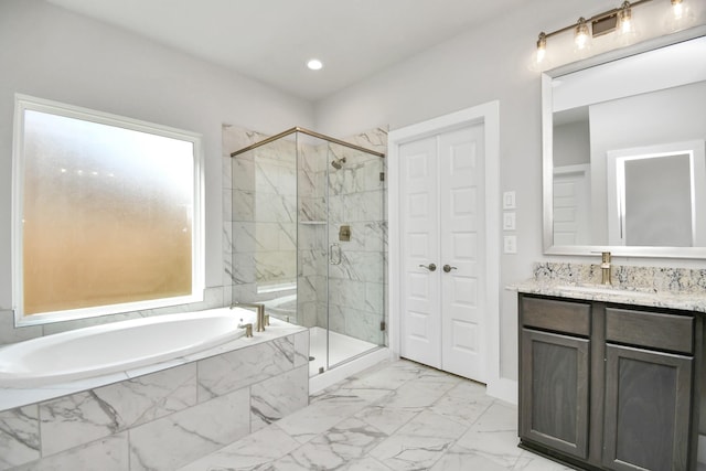 bathroom with vanity, a marble finish shower, a bath, and marble finish floor
