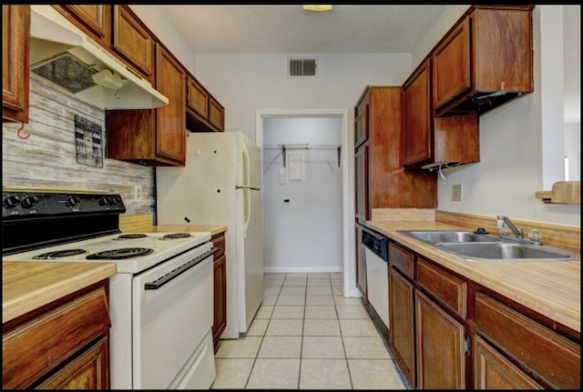 kitchen featuring sink, backsplash, stainless steel dishwasher, white electric range oven, and light tile patterned floors