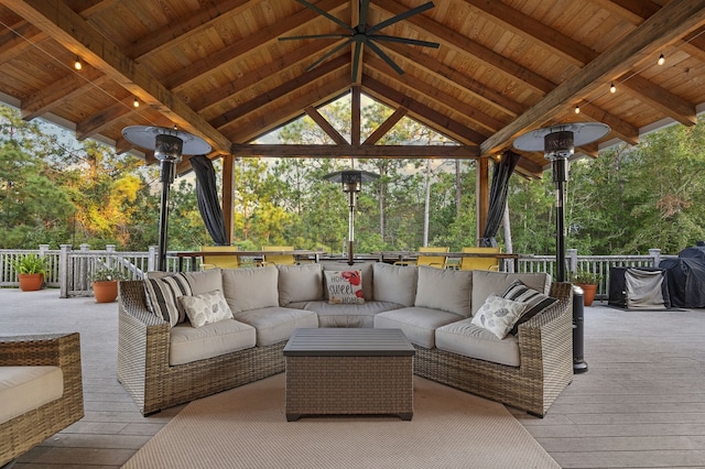 view of patio / terrace featuring a gazebo, a wooden deck, and an outdoor hangout area