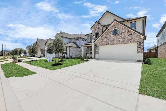 view of front of property with a front yard and a garage