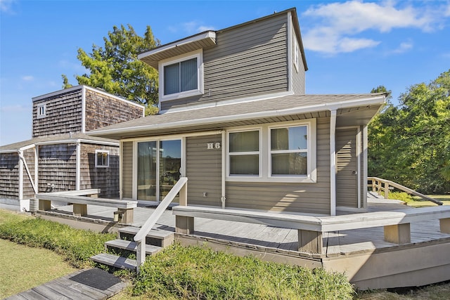 rear view of house with a wooden deck