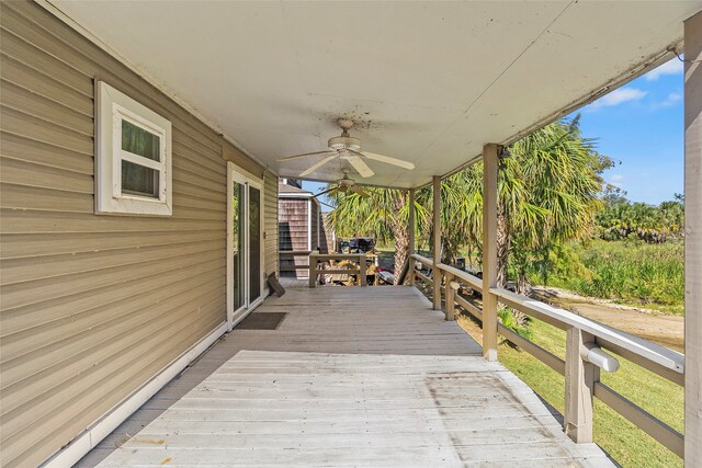 wooden terrace with ceiling fan