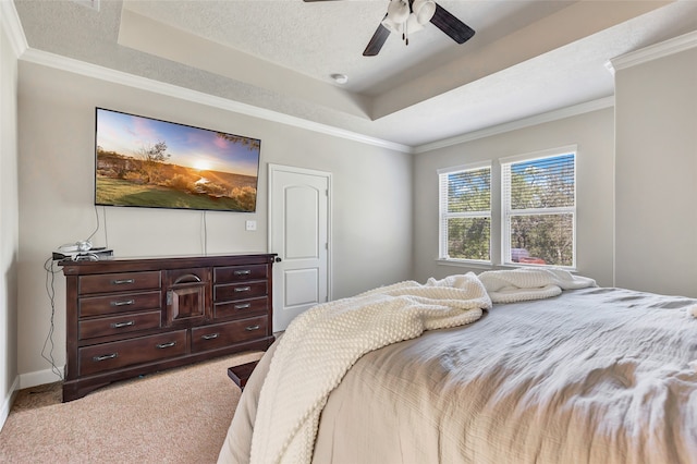 carpeted bedroom featuring ornamental molding, a textured ceiling, and ceiling fan