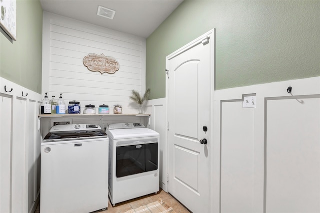 laundry room with washer and dryer