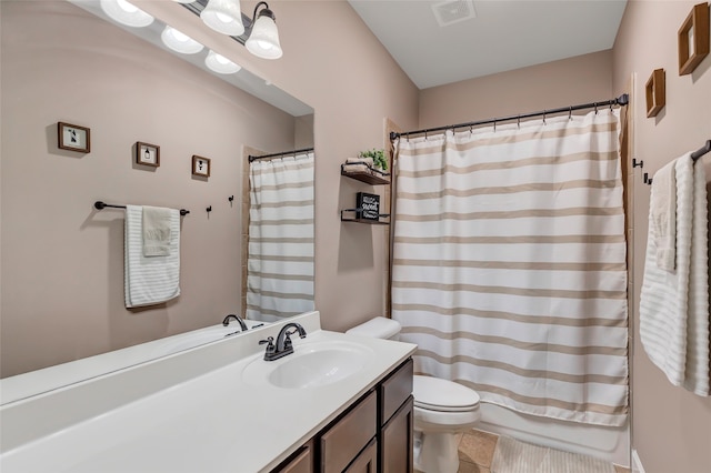 bathroom featuring vanity, toilet, and tile patterned floors