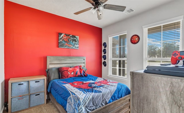 carpeted bedroom featuring ceiling fan