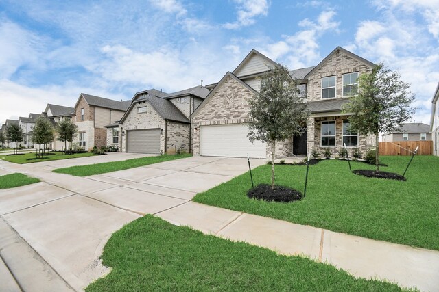 view of front of house with a front lawn and a garage