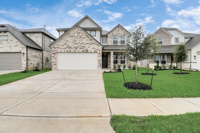 view of front of house featuring a front yard and a garage