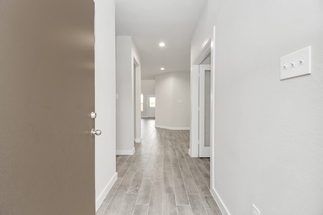 hall with light hardwood / wood-style flooring