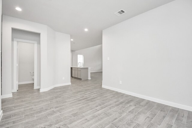 spare room featuring light hardwood / wood-style flooring