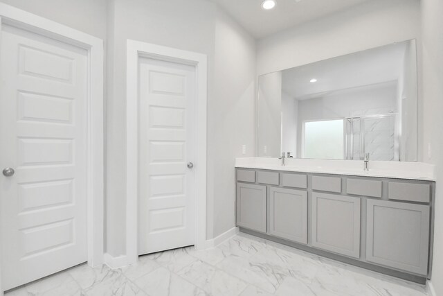 bathroom featuring vanity and walk in shower