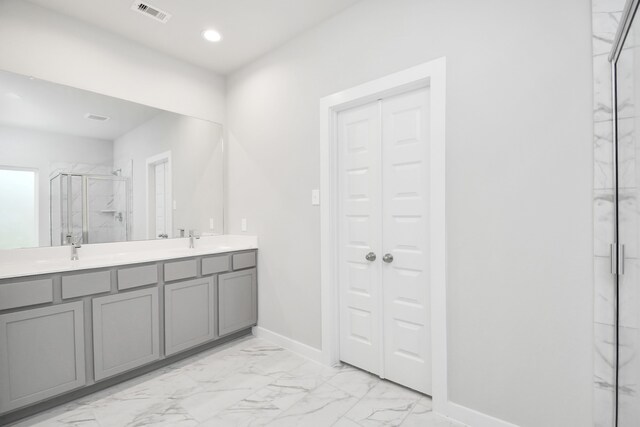 bathroom with vanity and an enclosed shower