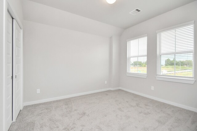 unfurnished bedroom with light carpet