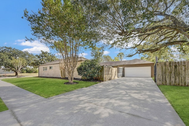 ranch-style house featuring a front yard and a garage