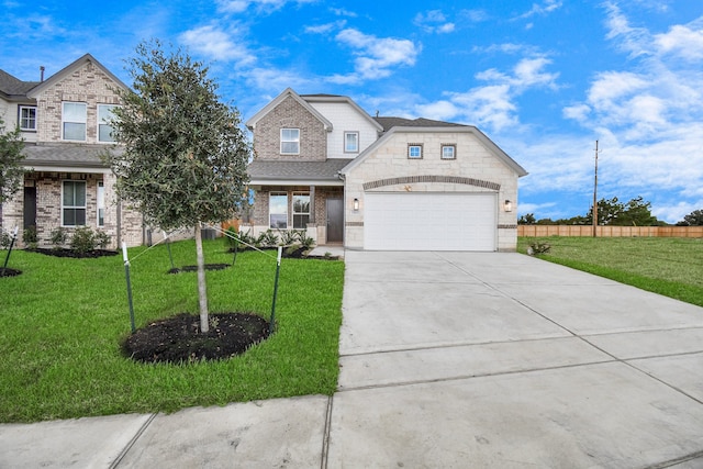 view of front facade with a front yard and a garage