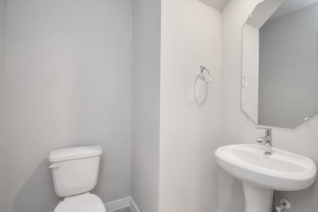 bathroom with sink and toilet