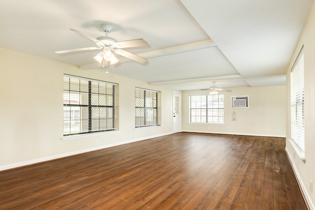 unfurnished room featuring dark wood-type flooring, ceiling fan, and a wall mounted AC