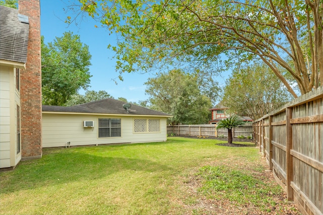 view of yard featuring a wall unit AC