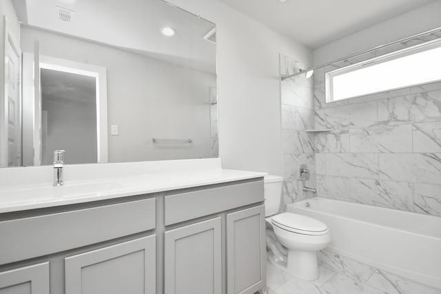 full bathroom featuring visible vents, toilet, shower / bath combination, vanity, and marble finish floor