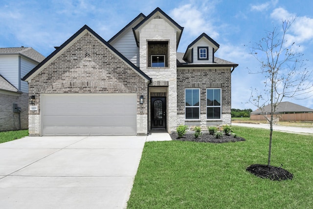 view of front of house with a front lawn and a garage