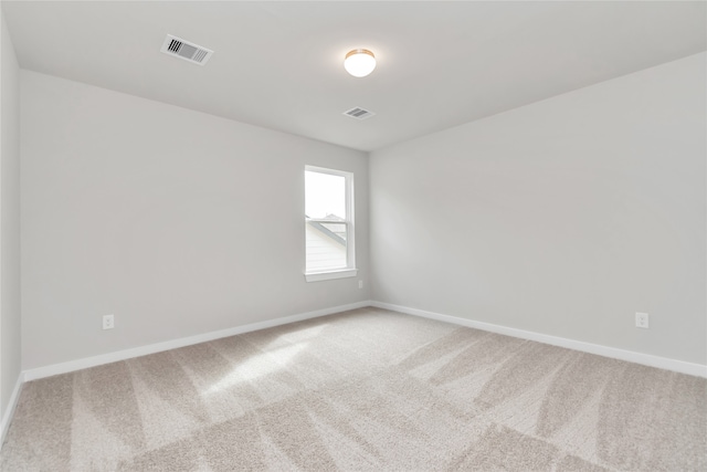 spare room featuring carpet flooring