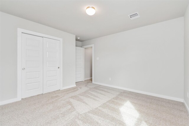 14707 Surfbird Ln, Houston, TX 77049 - unfurnished bedroom with carpet, a closet, and baseboards