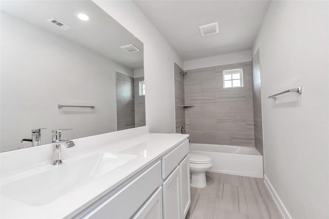 14707 Surfbird Ln, Houston, TX 77049 - bathroom with toilet, vanity, baseboards, washtub / shower combination, and recessed lighting