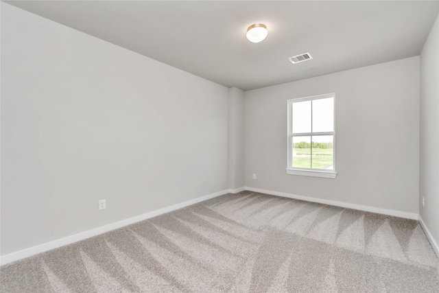 spare room featuring carpet flooring