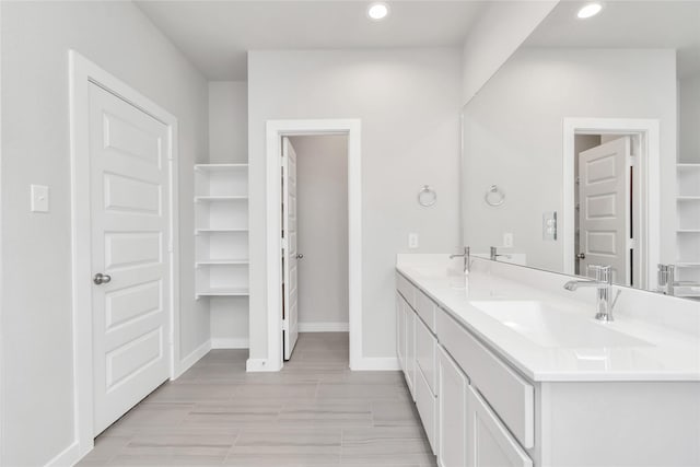 14707 Surfbird Ln, Houston, TX 77049 - full bath featuring double vanity, recessed lighting, and baseboards
