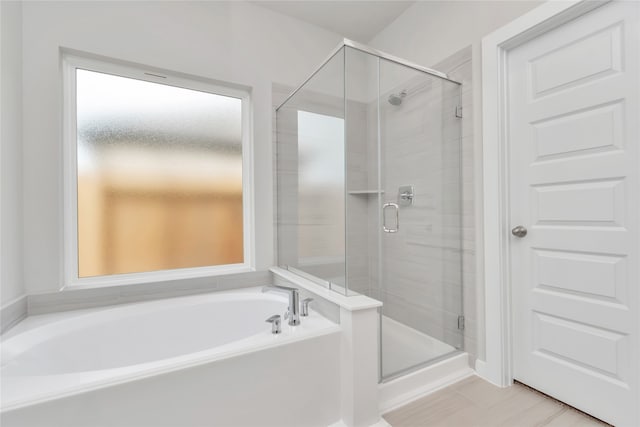 bathroom with independent shower and bath