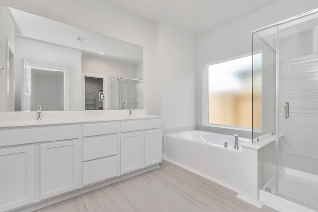 14707 Surfbird Ln, Houston, TX 77049 - full bathroom featuring a shower stall, double vanity, and a bath