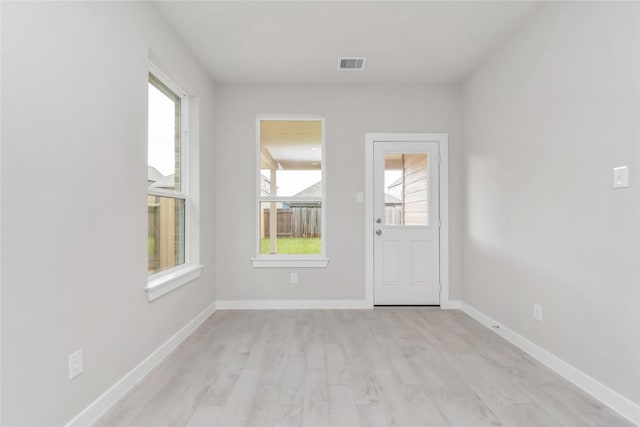 14707 Surfbird Ln, Houston, TX 77049 - spare room with healthy amount of natural light, light wood-style flooring, and baseboards