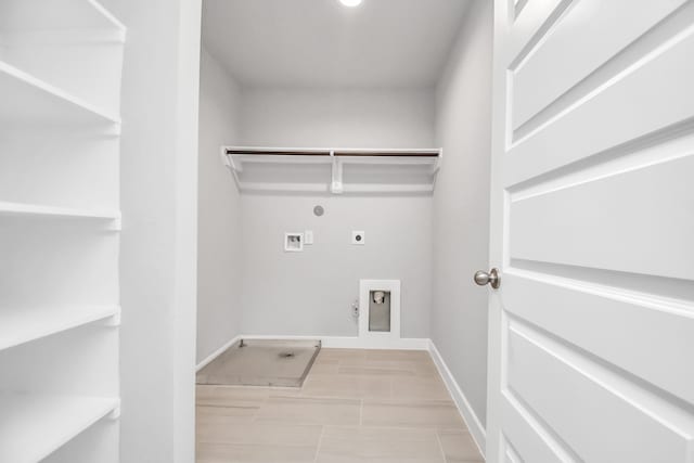 laundry area with hookup for a gas dryer, electric dryer hookup, and hookup for a washing machine