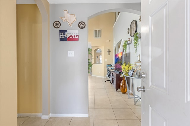 hallway featuring light tile patterned floors