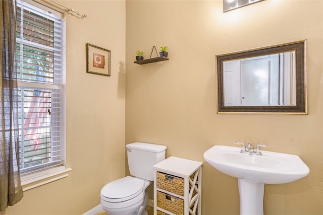 bathroom featuring toilet and sink