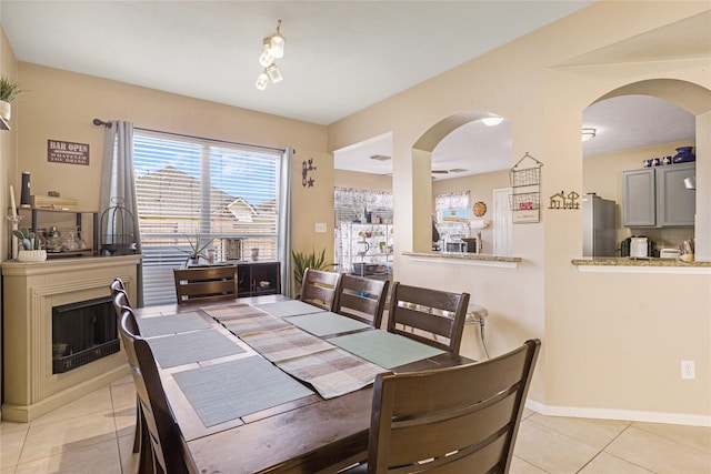 dining area with light tile patterned flooring