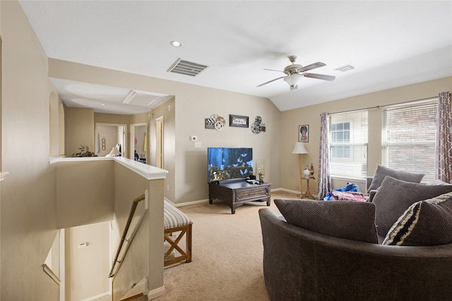 carpeted living room featuring vaulted ceiling and ceiling fan