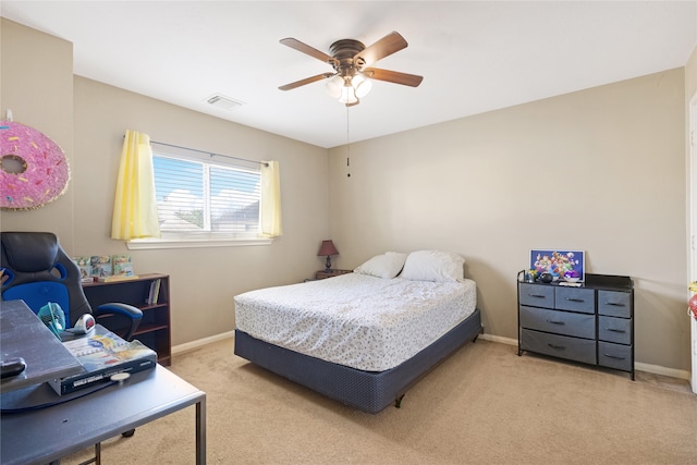 bedroom with light carpet and ceiling fan