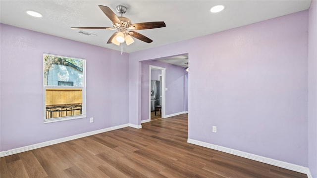 unfurnished room with hardwood / wood-style flooring and ceiling fan