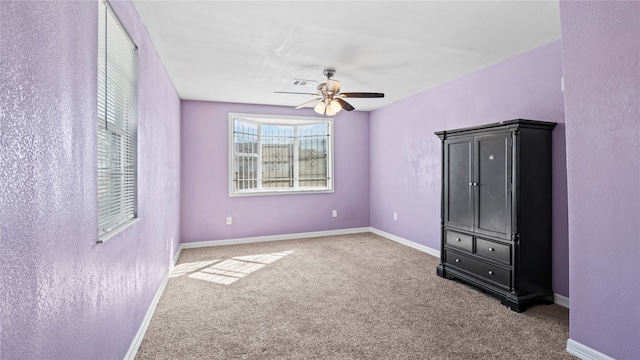 unfurnished bedroom with carpet and ceiling fan